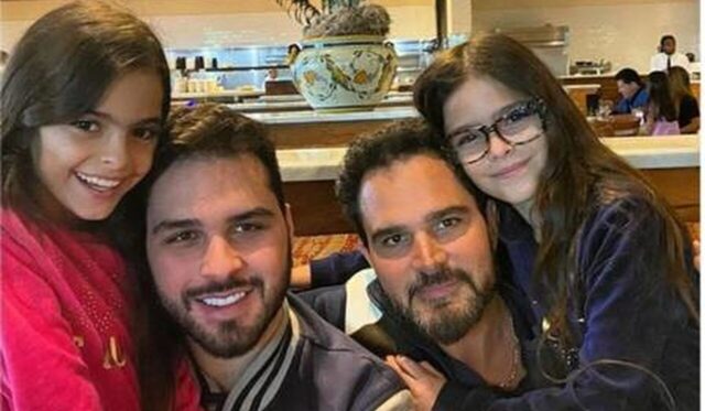 Uma foto de Luciano Camargo com os filhos